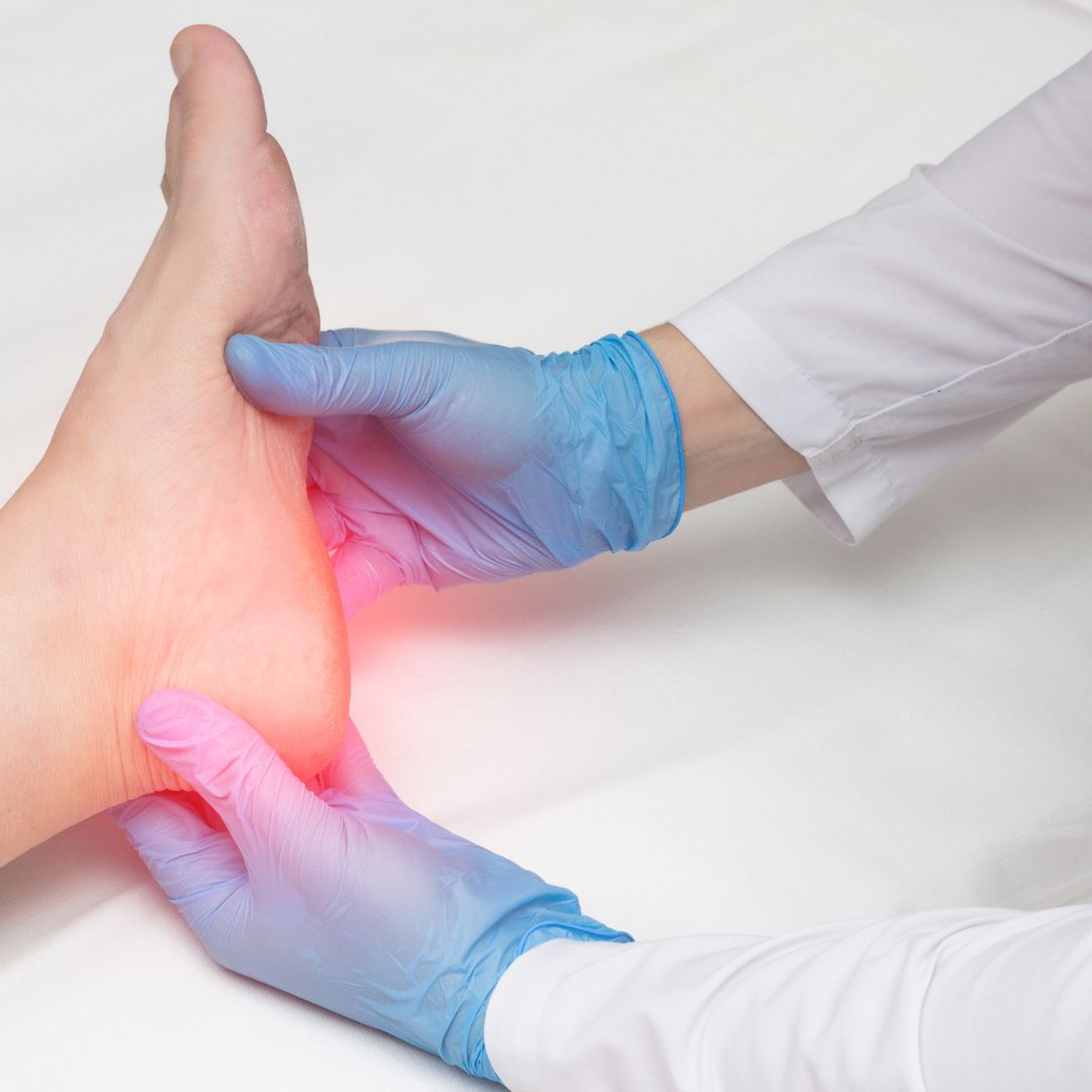 close up of a doctor examining a foot