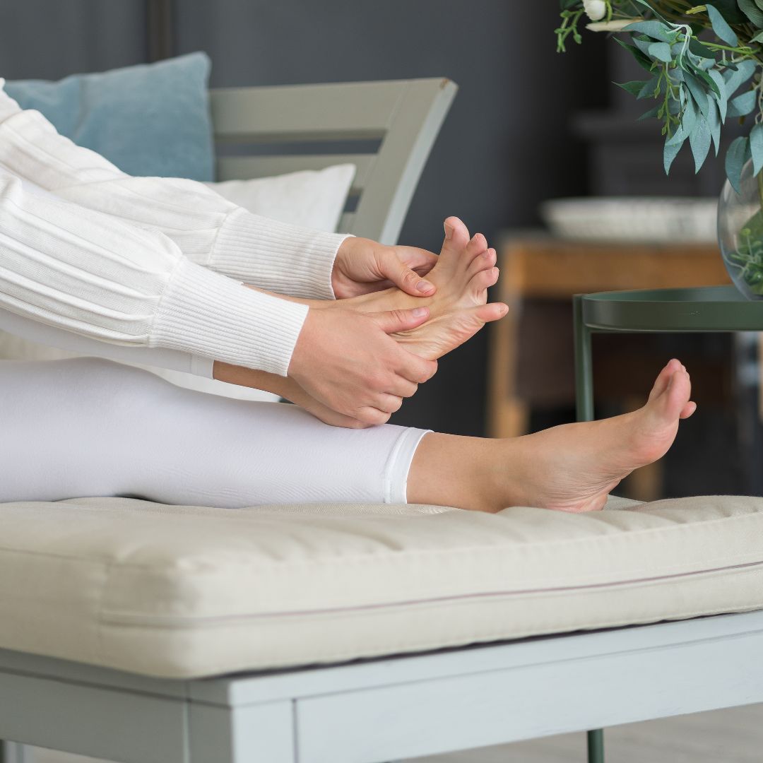 older woman stretching foot