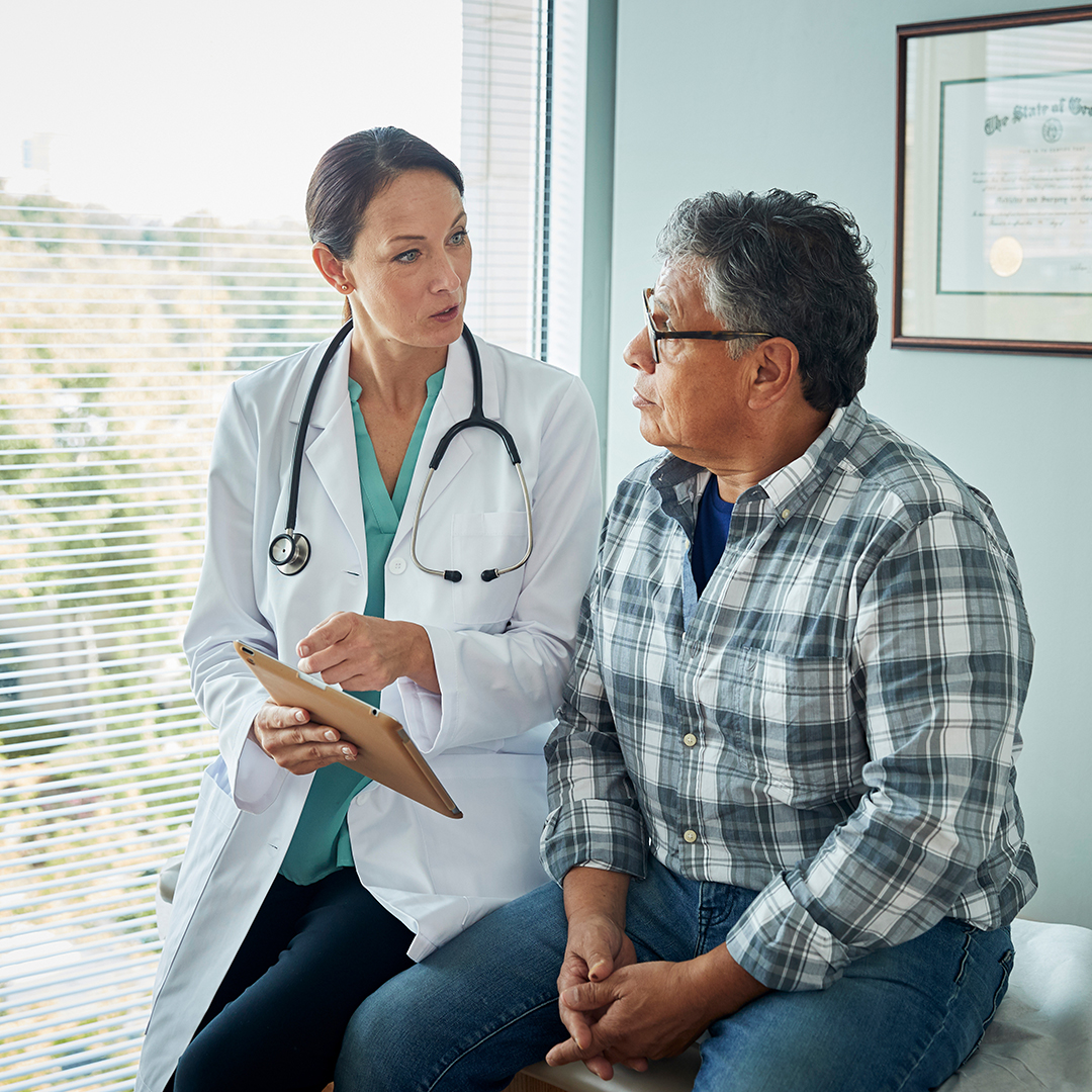 Doctor speaks with male patient