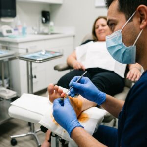 doctor looking at ingrown toenail